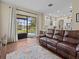 Open floor plan with a living room and kitchen overlooking the screened pool and lake at 9034 Paolos Place Paolos Place, Kissimmee, FL 34747