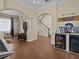 Spacious living room featuring tile floors, open archways, and a beverage center at 9034 Paolos Place Paolos Place, Kissimmee, FL 34747