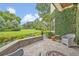 Private backyard oasis with lush greenery, a stone patio, and a tranquil seating area at 922 N Pennsylvania Ave, Winter Park, FL 32789