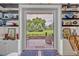 The backyard has well manicured landscaping, an outdoor patio area, and nice shelving inside the house at 922 N Pennsylvania Ave, Winter Park, FL 32789