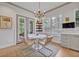 Cozy breakfast nook with bright light, comfortable seating, and an inviting atmosphere for starting the day at 922 N Pennsylvania Ave, Winter Park, FL 32789