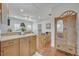 Charming kitchen with wooden cabinets, a breakfast table, and seamlessly flowing into the cozy living space at 922 N Pennsylvania Ave, Winter Park, FL 32789
