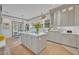 Bright kitchen showcasing a center island, stainless appliances, and ample counter space for meal preparation and casual dining at 922 N Pennsylvania Ave, Winter Park, FL 32789
