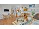 Inviting living room with hardwood floors, stylish decor, comfortable seating, and a dining area at 922 N Pennsylvania Ave, Winter Park, FL 32789