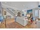 Spacious living room with stylish decor, staircase access, and an open layout perfect for entertaining at 922 N Pennsylvania Ave, Winter Park, FL 32789