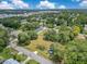 Aerial shot of a large property featuring mature trees, green space, and neighborhood surroundings at 9329 7Th Ave, Orlando, FL 32824