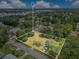 Aerial view of land lot surrounded by lush greenery in a suburban neighborhood at 9329 7Th Ave, Orlando, FL 32824
