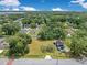 Aerial view of property showcasing spacious lot, mature trees, and surrounding neighborhood at 9329 7Th Ave, Orlando, FL 32824