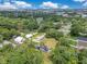 High aerial perspective of property showcasing large lot, mature trees, and the surrounding neighborhood at 9329 7Th Ave, Orlando, FL 32824