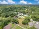 Property aerial view showcases green trees and lawns in a residential neighborhood at 9329 7Th Ave, Orlando, FL 32824
