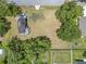 Spacious lot featuring mature trees and a home with a backyard and driveway at 9329 7Th Ave, Orlando, FL 32824