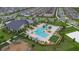 Aerial view of community amenities, including a pool, playground, and seating at 9941 Introduction Way, Orlando, FL 32832