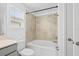 Well-lit bathroom featuring tiled shower, bathtub, and toilet at 9941 Introduction Way, Orlando, FL 32832