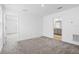 Spacious bedroom with neutral carpet, and adjoining bathroom at 9941 Introduction Way, Orlando, FL 32832