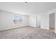 Carpeted bedroom with neutral walls and natural light from the window at 9941 Introduction Way, Orlando, FL 32832
