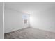 Bright bedroom featuring a window and neutral carpet at 9941 Introduction Way, Orlando, FL 32832