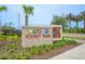 Beautiful stone sign for Storey Park community surrounded by lush landscaping at 9941 Introduction Way, Orlando, FL 32832
