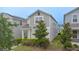 Charming two-story home featuring a mix of siding and manicured landscaping at 9941 Introduction Way, Orlando, FL 32832