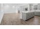 Modern kitchen island with tile flooring, sink and views to an outdoor space at 9941 Introduction Way, Orlando, FL 32832