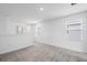 Carpeted open loft area featuring recessed lighting and bright windows at 9941 Introduction Way, Orlando, FL 32832