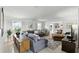 Bright living room featuring lots of seating, large windows, neutral walls, and decorative accents at 1000 Kewannee Trl, Maitland, FL 32751