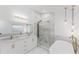 Stunning bathroom with marble counters, dual sinks, glass shower and standalone tub, and modern lighting at 10001 Newington Dr, Orlando, FL 32836