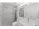 Modern bathroom featuring a sleek vanity and a luxurious glass-enclosed shower with marble accents at 10001 Newington Dr, Orlando, FL 32836