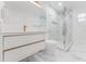 Stylish bathroom with a floating vanity and a glass-enclosed shower, highlighting modern design elements at 10001 Newington Dr, Orlando, FL 32836