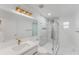 Modern bathroom featuring a sleek vanity and a luxurious glass-enclosed shower with marble accents at 10001 Newington Dr, Orlando, FL 32836