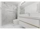 Modern bathroom featuring a sleek glass shower, marble accents, and a stylish white vanity with gold trim at 10001 Newington Dr, Orlando, FL 32836