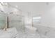 Elegant bathroom featuring a standalone tub, glass shower, and marble accents, creating a spa-like retreat at 10001 Newington Dr, Orlando, FL 32836