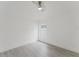 Bright bedroom featuring light hardwood floors, a ceiling fan, and a window for natural light at 10001 Newington Dr, Orlando, FL 32836