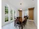 Bright dining room with large windows and modern light fixture at 10001 Newington Dr, Orlando, FL 32836