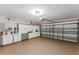 Spacious garage featuring ample storage cabinets, providing an organized area for vehicles and equipment at 10001 Newington Dr, Orlando, FL 32836