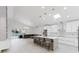 Open-concept kitchen featuring a large island with seating and stainless steel appliances at 10001 Newington Dr, Orlando, FL 32836