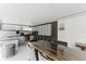 Outdoor kitchen with granite countertops, stainless steel grill, and seating area at 10001 Newington Dr, Orlando, FL 32836