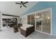 Large covered patio with outdoor kitchen, dining area, and comfortable seating at 10001 Newington Dr, Orlando, FL 32836
