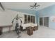 Spacious covered patio featuring a seating area and exercise equipment at 10001 Newington Dr, Orlando, FL 32836
