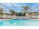 Sparkling swimming pool with water features and tropical landscaping at 10001 Newington Dr, Orlando, FL 32836