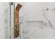 Luxurious shower with rainfall shower head, body jets, and elegant marble tile at 10001 Newington Dr, Orlando, FL 32836