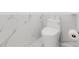 Modern white toilet with sleek design and marble accents at 10001 Newington Dr, Orlando, FL 32836