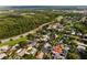 Neighborhood aerial featuring tree-lined streets, mature trees, well-maintained lawns and homes, adjacent to a nature preserve at 1008 Soldier Creek Ct, Oviedo, FL 32765