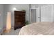 Cozy bedroom features a large wooden dresser, neutral colors, and plush carpeting at 1008 Soldier Creek Ct, Oviedo, FL 32765