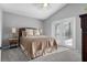 Light-filled main bedroom with a king bed, soft carpet, and double doors to the outside at 1008 Soldier Creek Ct, Oviedo, FL 32765
