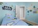 Blue bedroom featuring a closet, a bed, and a natural light window at 1008 Soldier Creek Ct, Oviedo, FL 32765