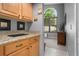 Attached room with a window, cabinet, and neutral decor at 1008 Soldier Creek Ct, Oviedo, FL 32765