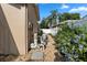 Exterior side view showing the home's utility equipment and landscaping at 1008 Soldier Creek Ct, Oviedo, FL 32765
