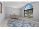 Bright living room with vaulted ceilings, a console table, and a large arched window at 1008 Soldier Creek Ct, Oviedo, FL 32765