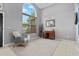 Open-concept living room with tiled flooring, a console table, and a large arched window at 1008 Soldier Creek Ct, Oviedo, FL 32765