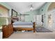 Spacious primary bedroom with ensuite bath, features a large bed and modern sliding door at 1008 Soldier Creek Ct, Oviedo, FL 32765